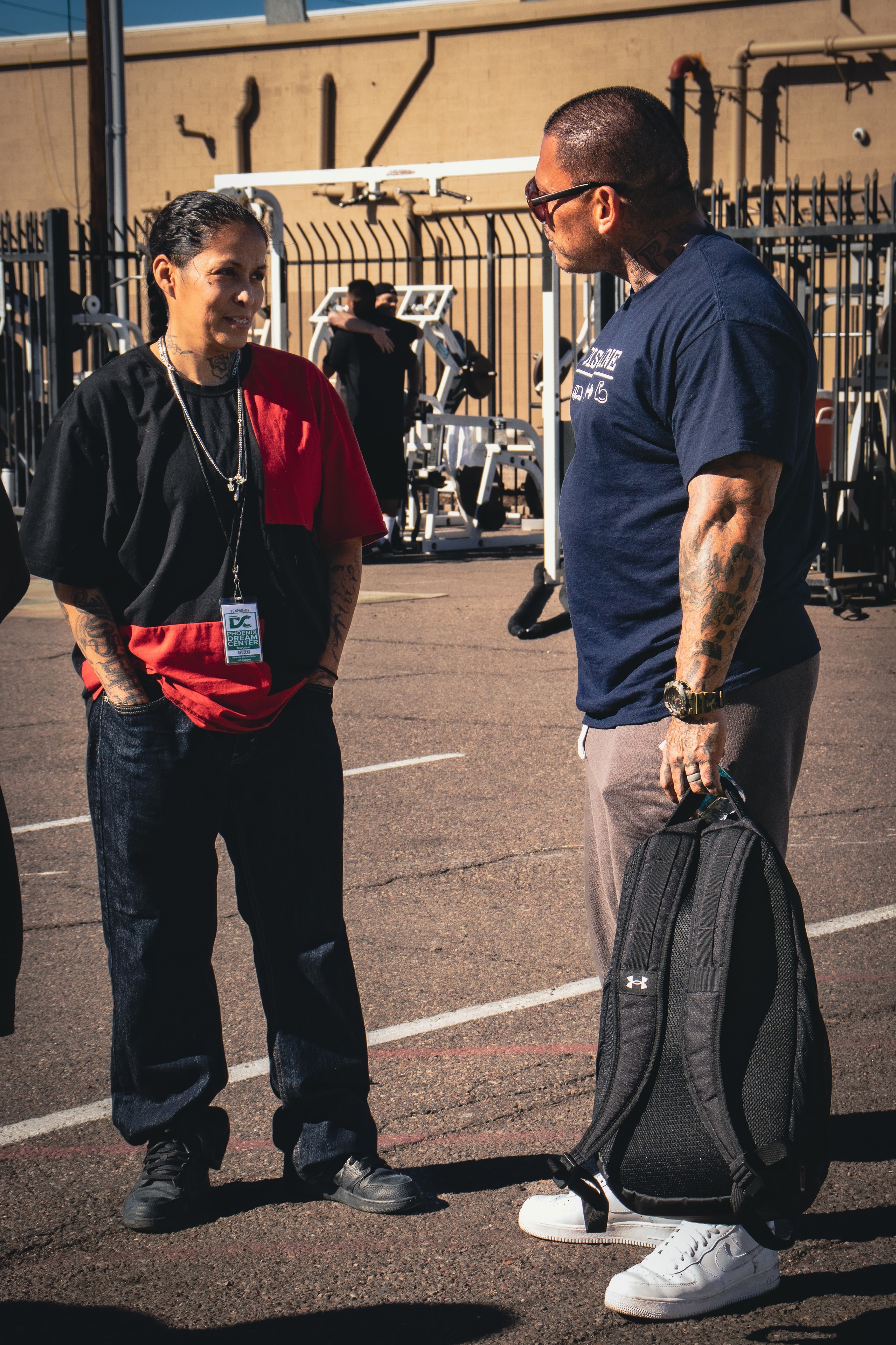 Julio in conversation with a participant at an outdoor program